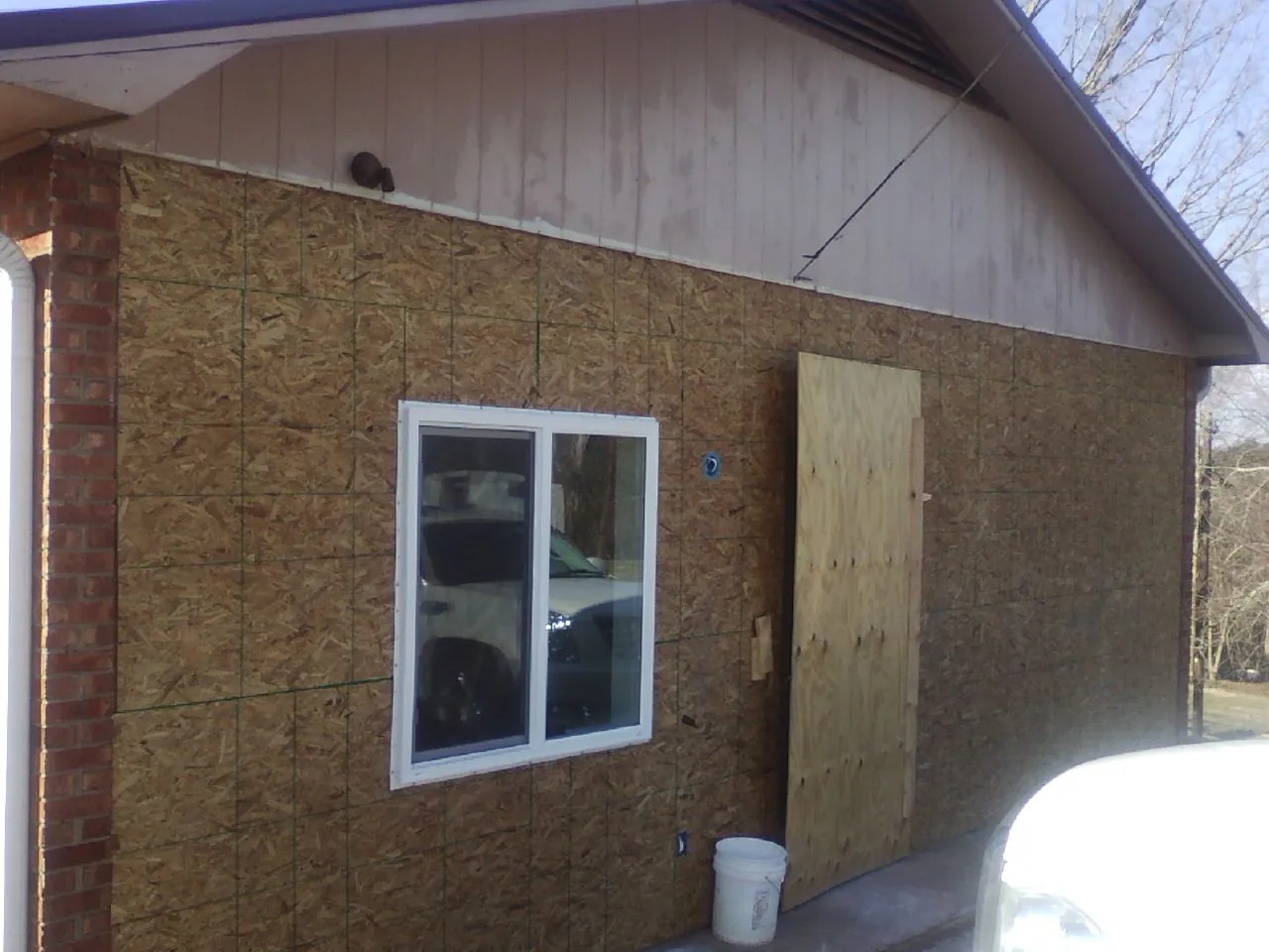 OSB sheathing on a garage addition wall before siding in Frankenmuth